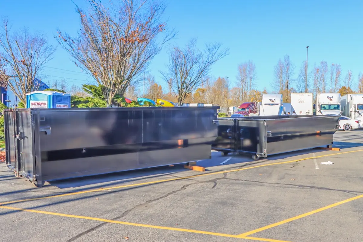 Professional dumpster rental service with roll-off container on residential driveway in Buckhall